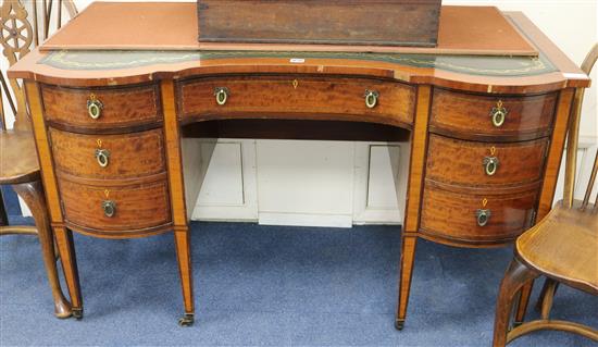 An Edwardian writing table W.130cm